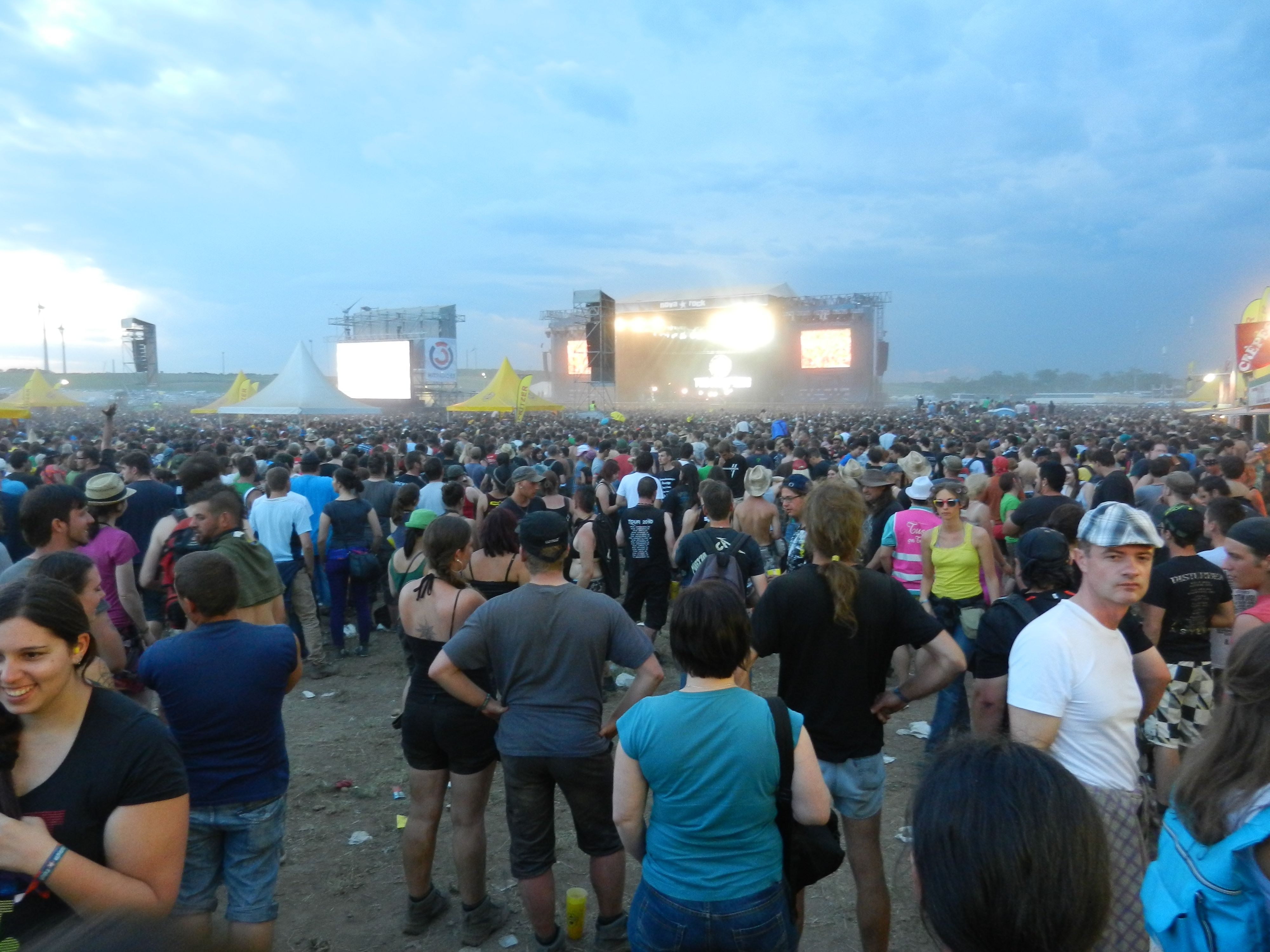 Crowd at an open air concert in front of the stage