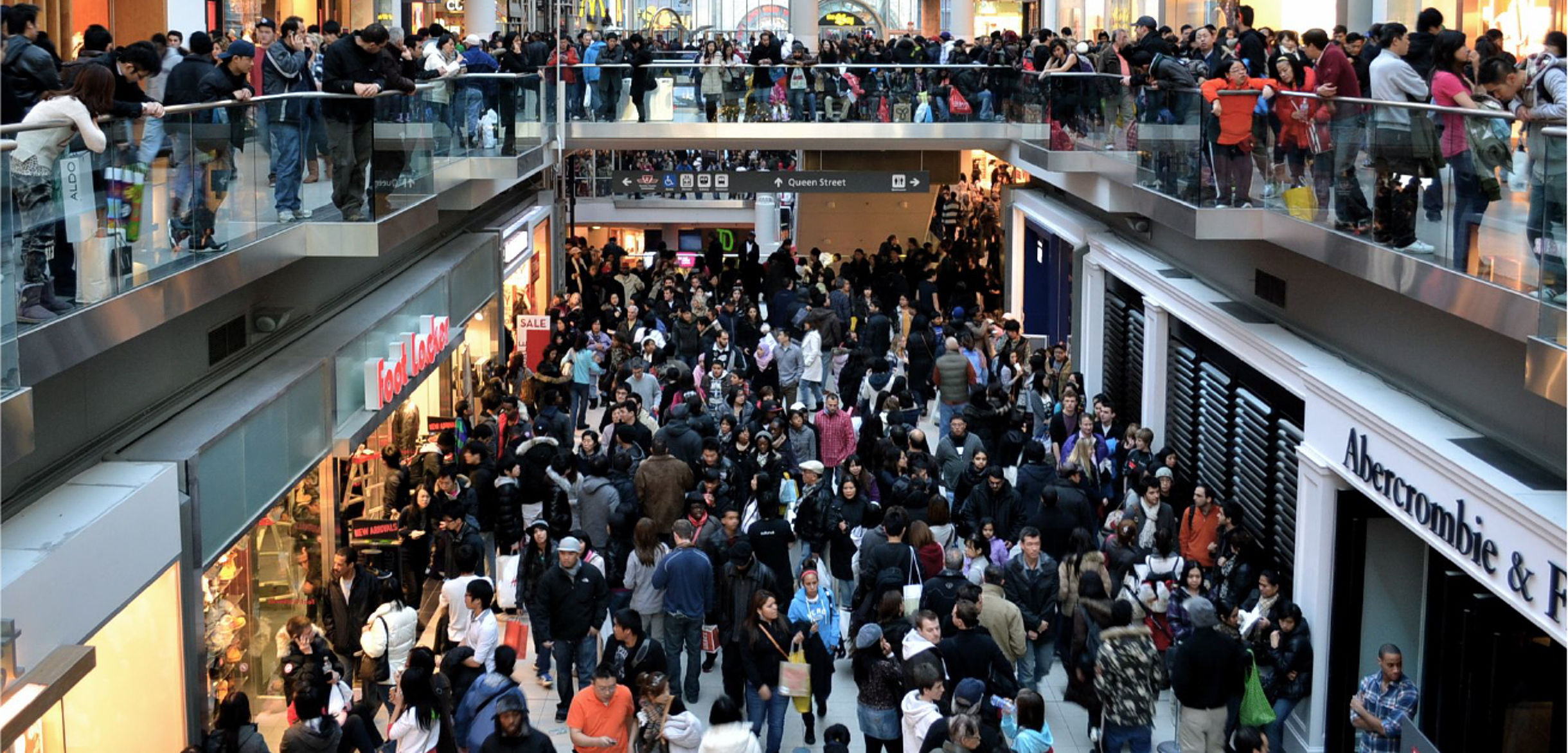 Shopping mall with crowds symbol photo