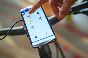 Smartphone on handlebar with the HealtheBike Interface