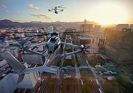 Simulation eines Hubschraubers über einer Stadt mit Sonnenuntergang