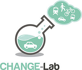 Change-Lab Logo: Chemistry Flesh that is half full with green liquid by floating a car. Above it is a haze in which a bus, a pedestrian, a bicycle, a car and a tram are.