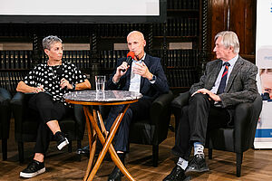 Panel discussion with three people