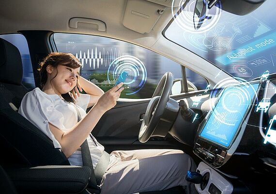 Person sitting in autonomous car