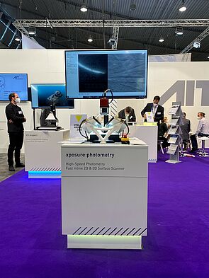 AIT booth, purple carpet, demonstrator xposure:photometry