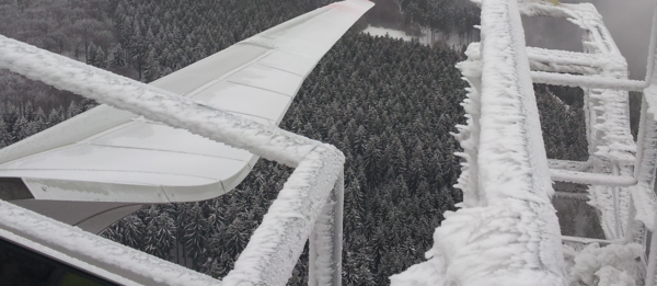 View from above on iced wind turbine , wintry landscape. Copyright VERBUND