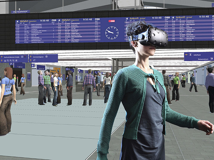 person uses VR-glasses and is with the help of these glasses standing in a train station