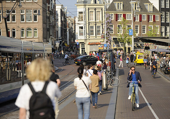  Passengers and trams on a road