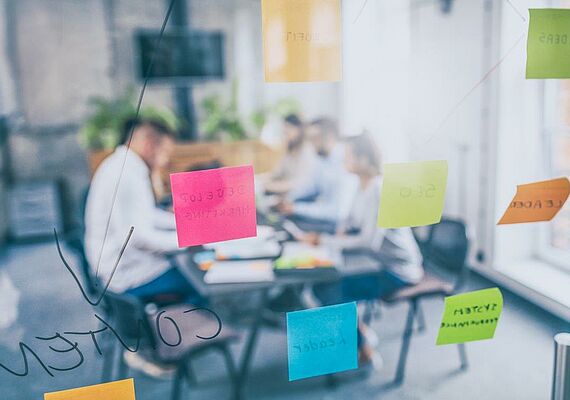 View through a glass front at a usability training.