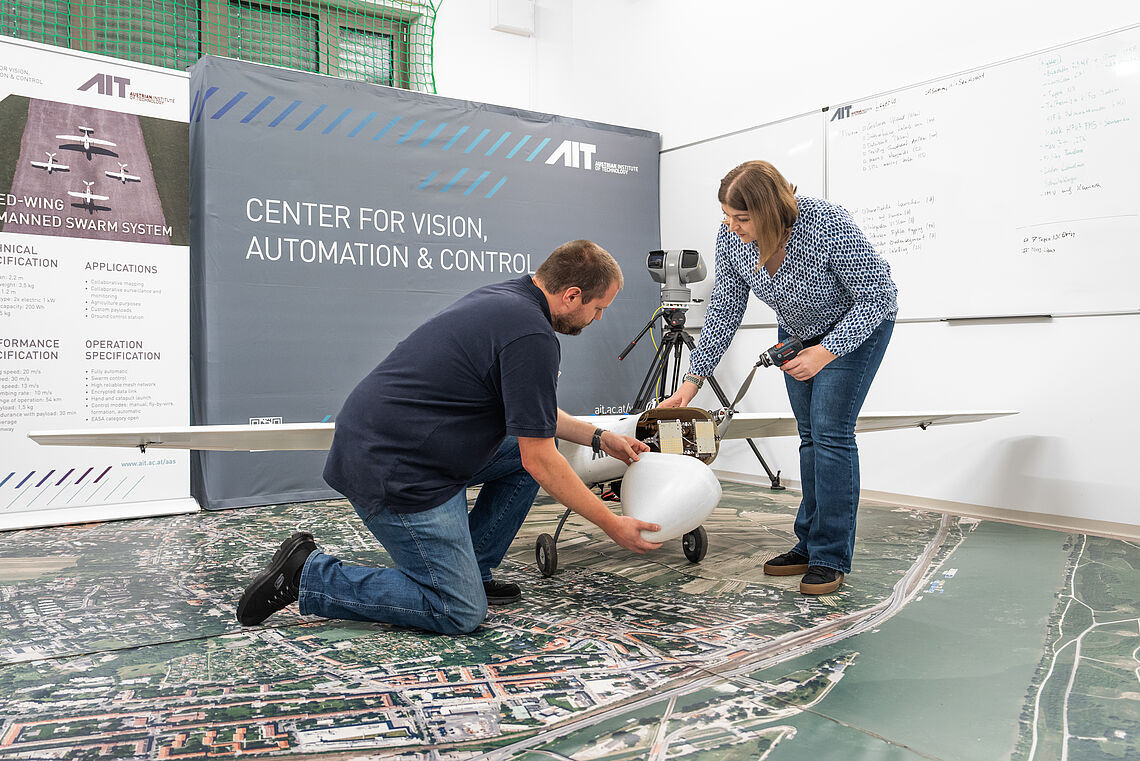 Verena Widhalm and Felix Bruckmüller install sensors in an unmanned aerial vehicle in the AIT Aerial Systems Lab
