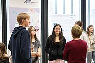 Gespräch vor AIT Banner