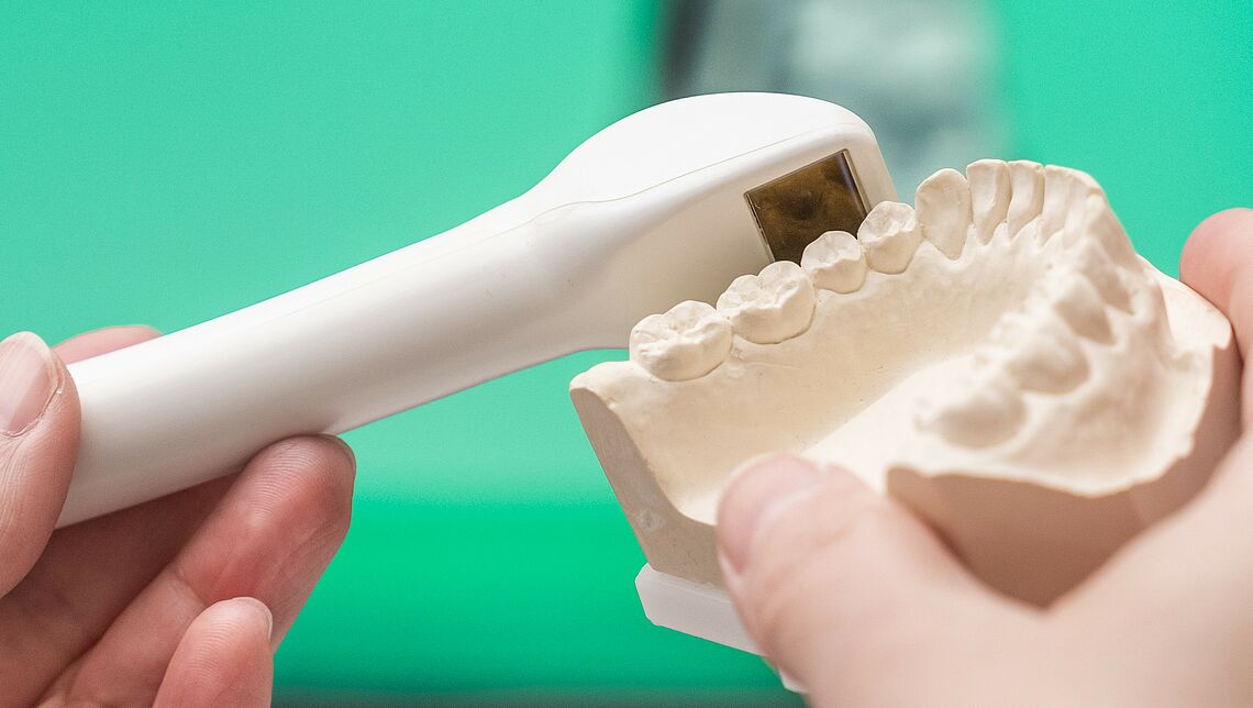 Hand-held dental scanner with plaster model of a lower jaw; Machine Vision Lab