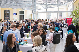 Room full of people with dHealth bags