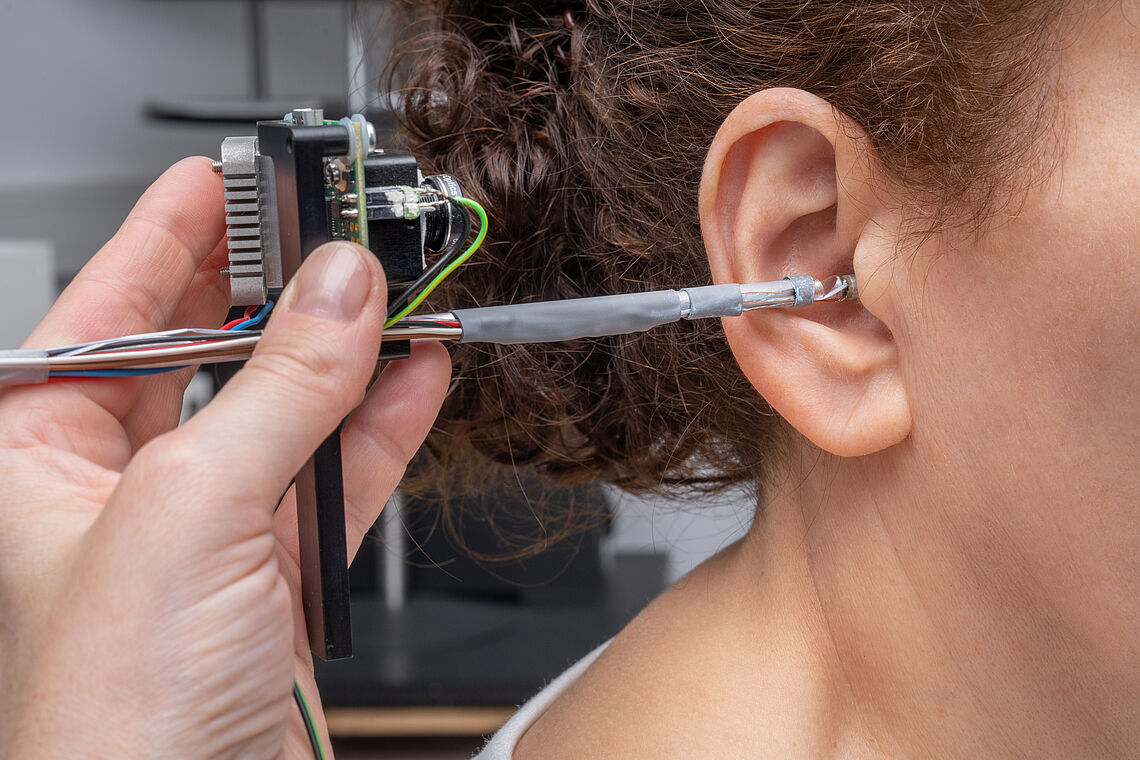 Hand-held ear scanner scanning a woman's ear canal; Machine Vision Lab