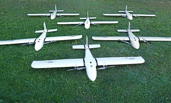 5 small unmanned aerial vehicles with sensors for airborne for common operational pictures - on a green background