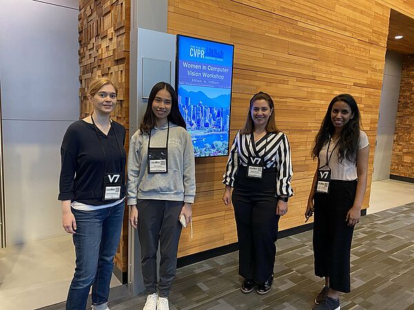 Doris Antensteiner, Ziqi Huang, Marah Halawa, Sachini Herath at an image processing conference in front of a monitor