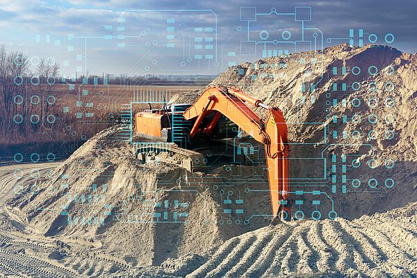 Orange excavator digging on a large mound of sand. Graphic shows the digital network