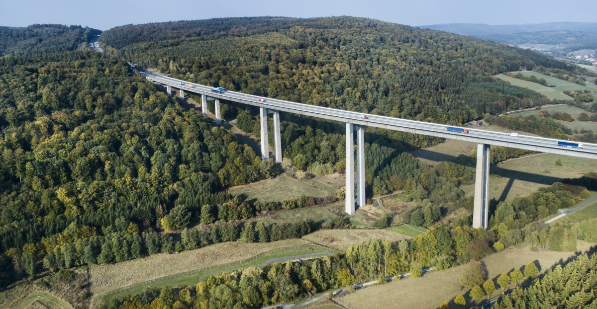 Highway bridge through forestland - aerial view