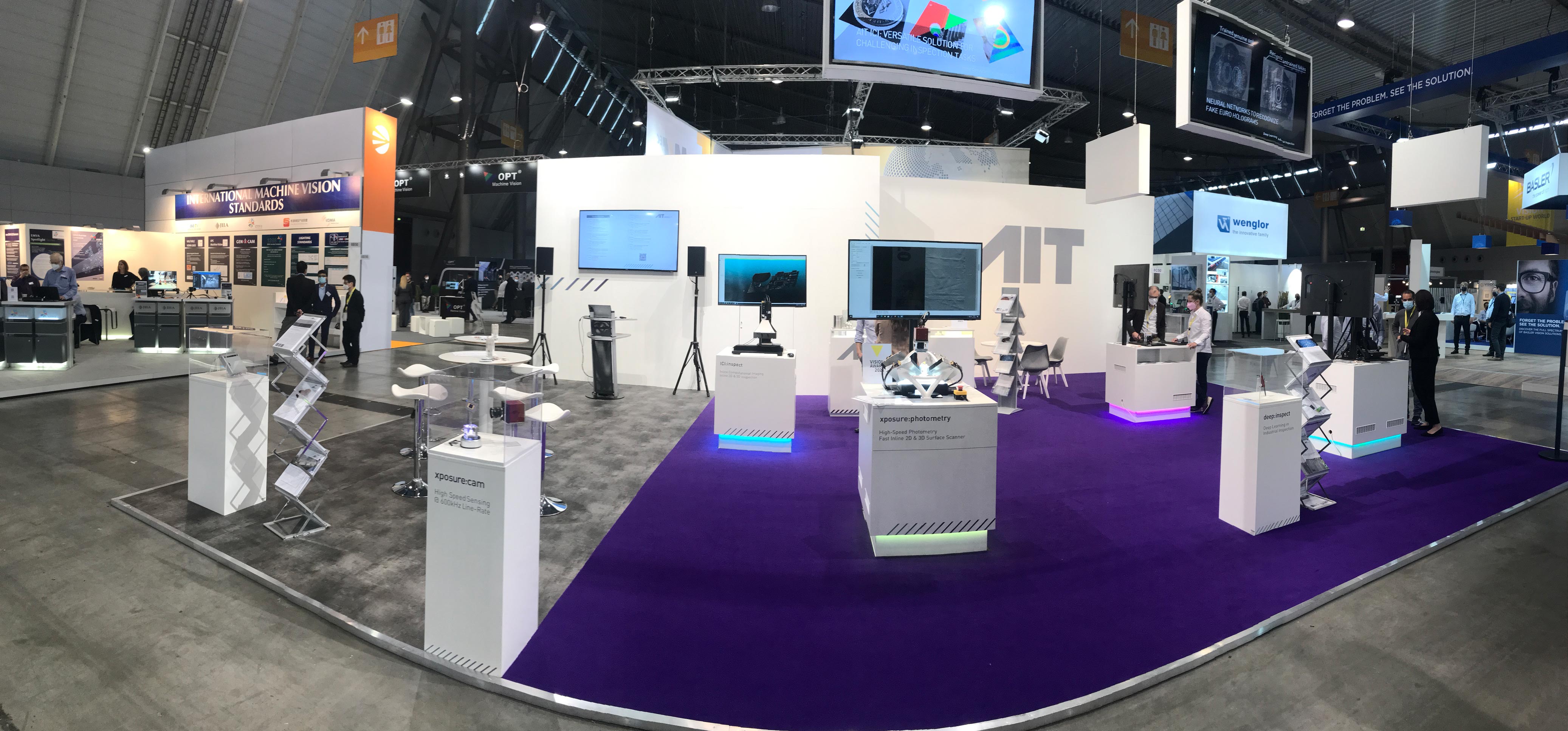 AIT booth, purple carpet, demonstrators, showcases, panorama image